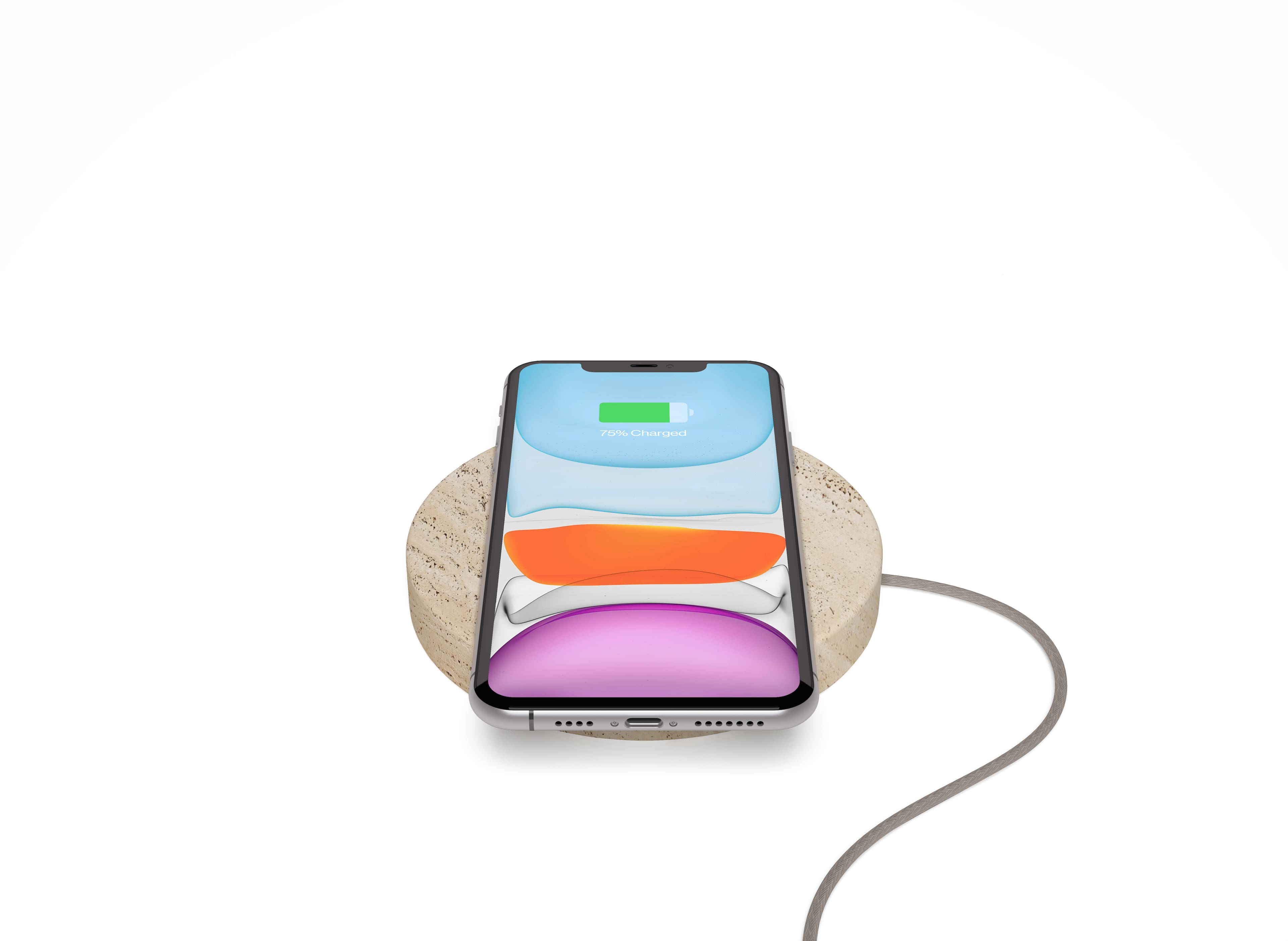 Einova Wireless Charging Stone on a desk with iPhone and AirPods